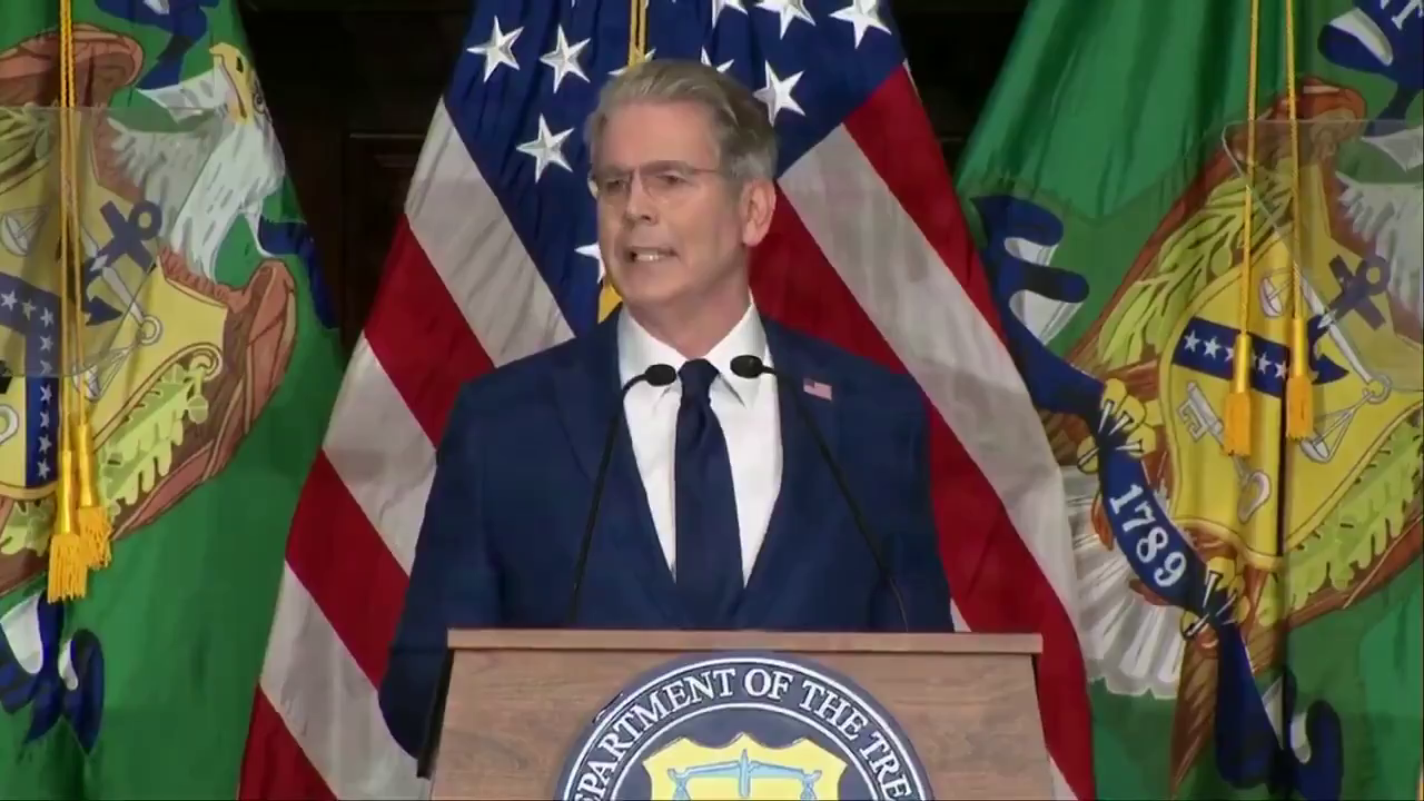 Treasury Secretary Scott Bessent speaking at a Treasury podium during the Operation Economic Outcast announcement.